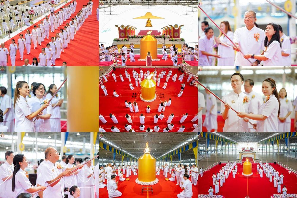 กลุ่มคนสวมชุดขาวร่วมพิธีจุดเทียนใจ ไฟนิรันดร์ อนันตชัย ภายในอาคารวัดพระธรรมกาย