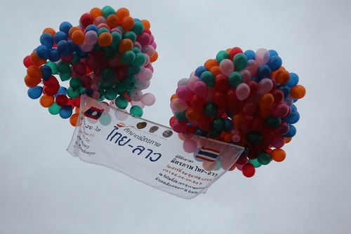 ภาพ No.9247:“ตักบาตรมิตรภาพไทย-ลาว” เนื่องในวันออกพรรษา 2556